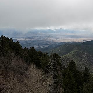 Image of a mountain canyon with a cloudy sky.